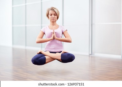 woman-floating-air-lotus-position-260nw-126937151